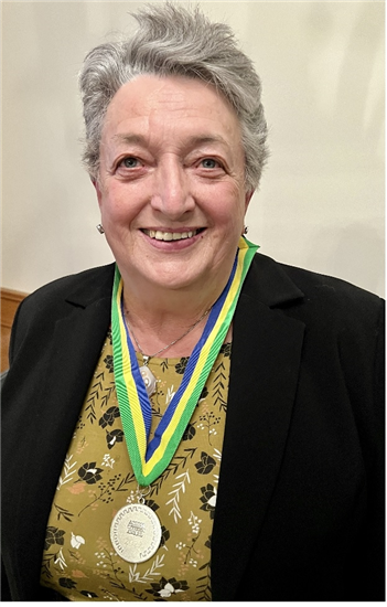 Image: Anne McEntee wearing her Acive Citizen medal
